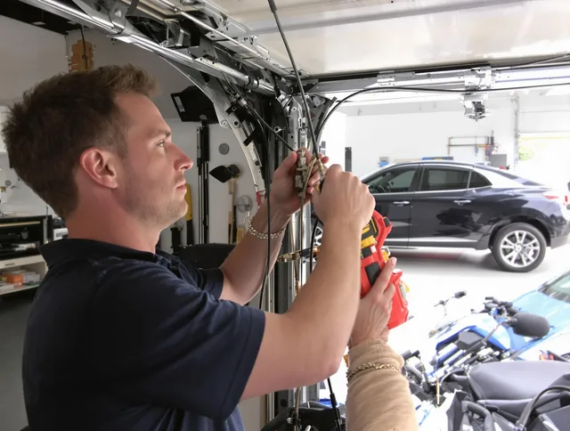 Hemet Garage Door Repair safety certified technician performing cable replacement in Hemet