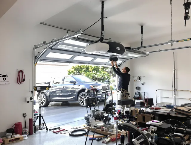 Hemet Garage Door Repair specialist installing smart garage door opener system in Hemet home